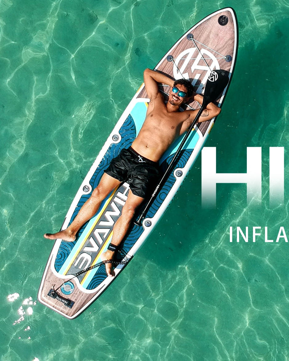 Person lying on an inflatable paddle board with 'HIWAVE' branding in clear water.